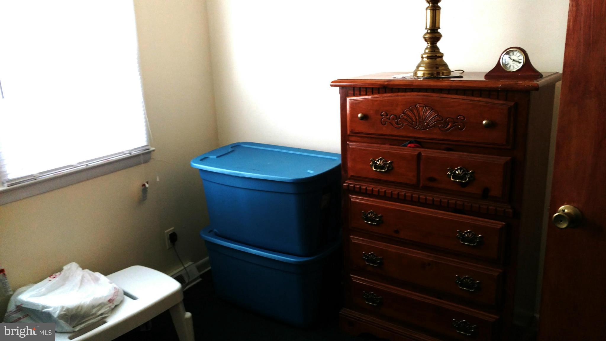 7136 Bexhill Road Baltimore, MD 21244 - Photo 14 of 27 a bathroom with a toilet and a sink