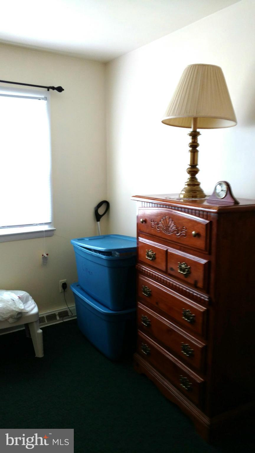 7136 Bexhill Road Baltimore, MD 21244 - Photo 15 of 27 a room with a desk and chair