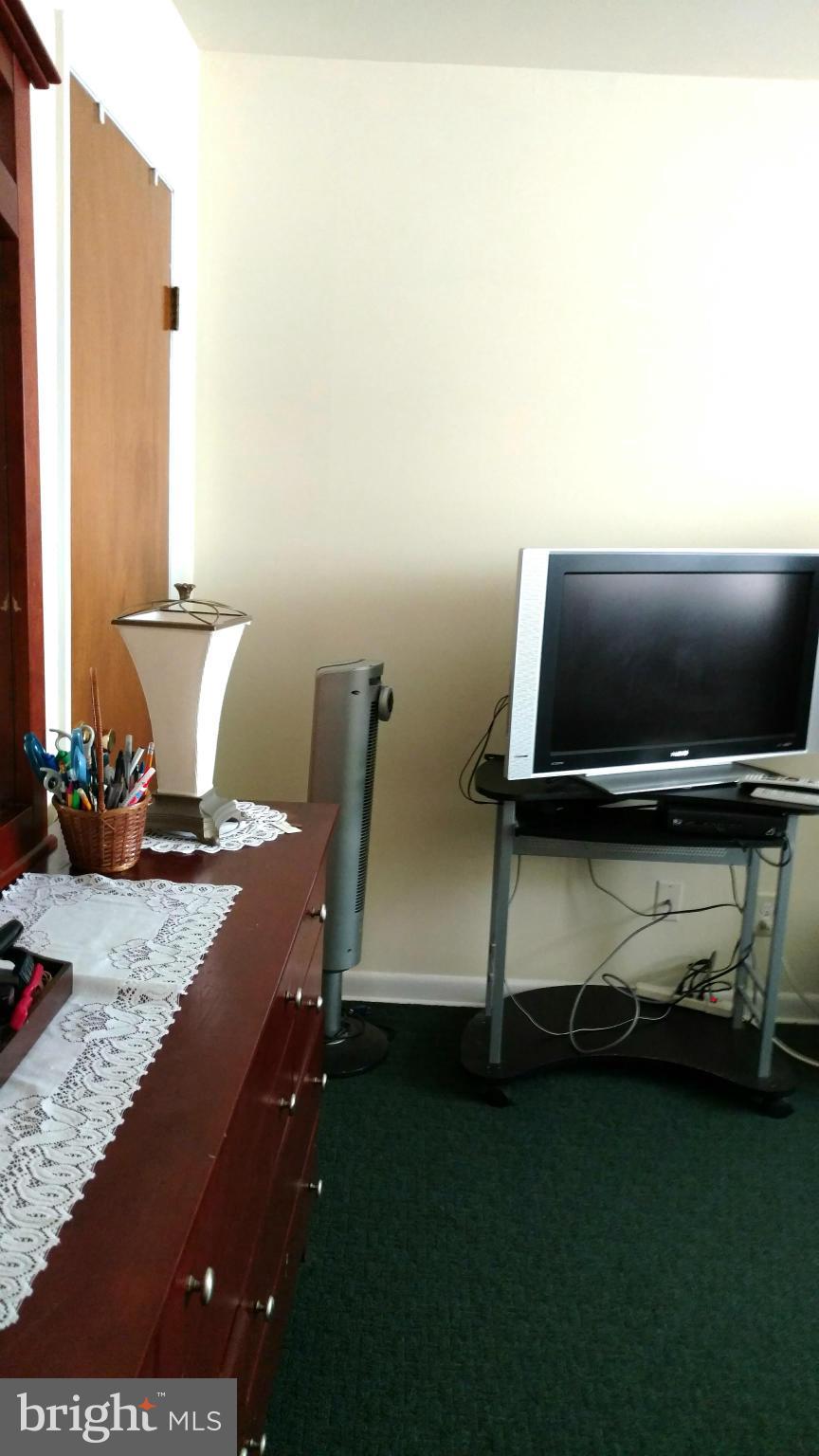 7136 Bexhill Road Baltimore, MD 21244 - Photo 17 of 27 a living room with furniture and a flat screen tv