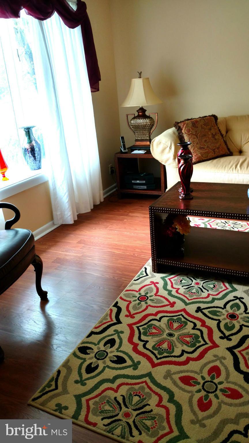 7136 Bexhill Road Baltimore, MD 21244 - Photo 3 of 27 a bedroom with bed and window