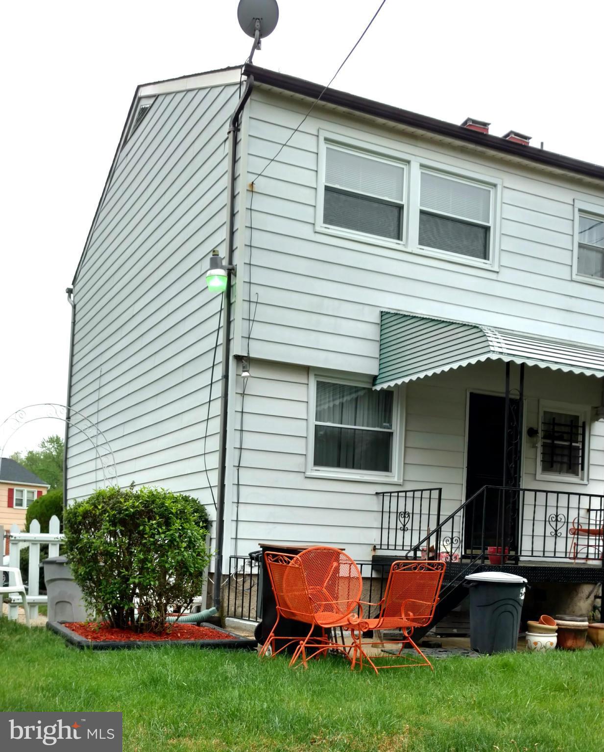 7136 Bexhill Road Baltimore, MD 21244 - Photo 24 of 27 a backyard of a house with wooden deck and barbeque oven