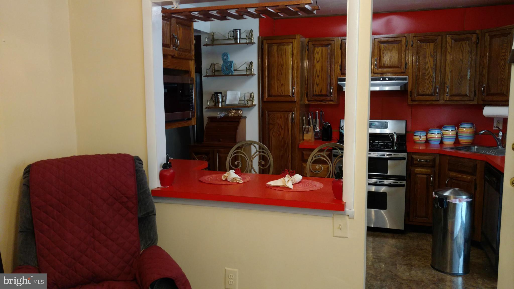 7136 Bexhill Road Baltimore, MD 21244 - Photo 9 of 27 a view of a kitchen with appliances and cabinets