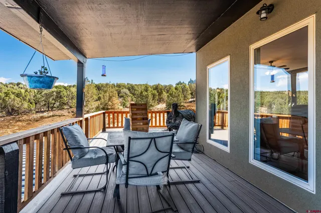 a view of a chairs on the roof deck