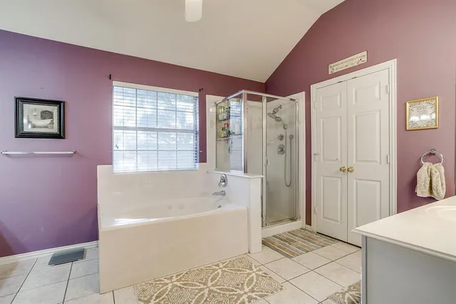 a bathroom with a bathtub shower and a sink