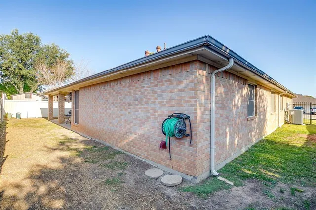 a backyard of a house with lots of green space