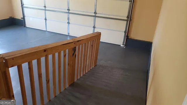 a view of a closet area with empty racks