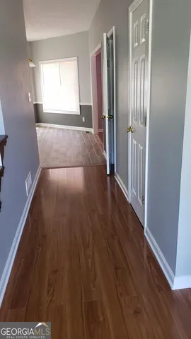 a view of entryway with wooden floor