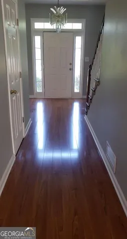 a view of lobby with wooden floor