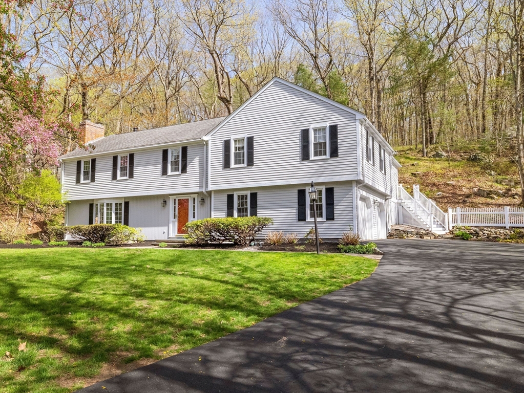 14 Pond Street Dover, MA 02030 - Photo 1 of 25 a front view of a house with a garden