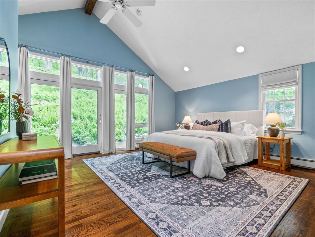 14 Pond Street Dover, MA 02030 - Photo 16 of 25 a bedroom with a bed and wooden floor