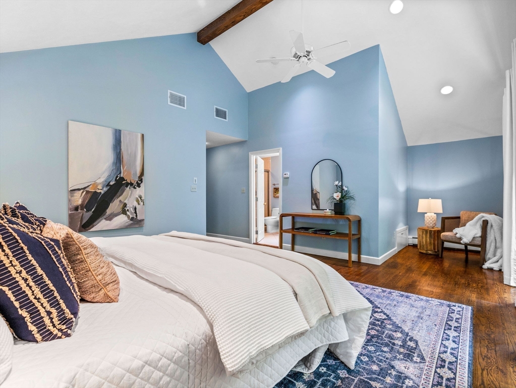 14 Pond Street Dover, MA 02030 - Photo 17 of 25 a bedroom with a bed large mirror and lamp