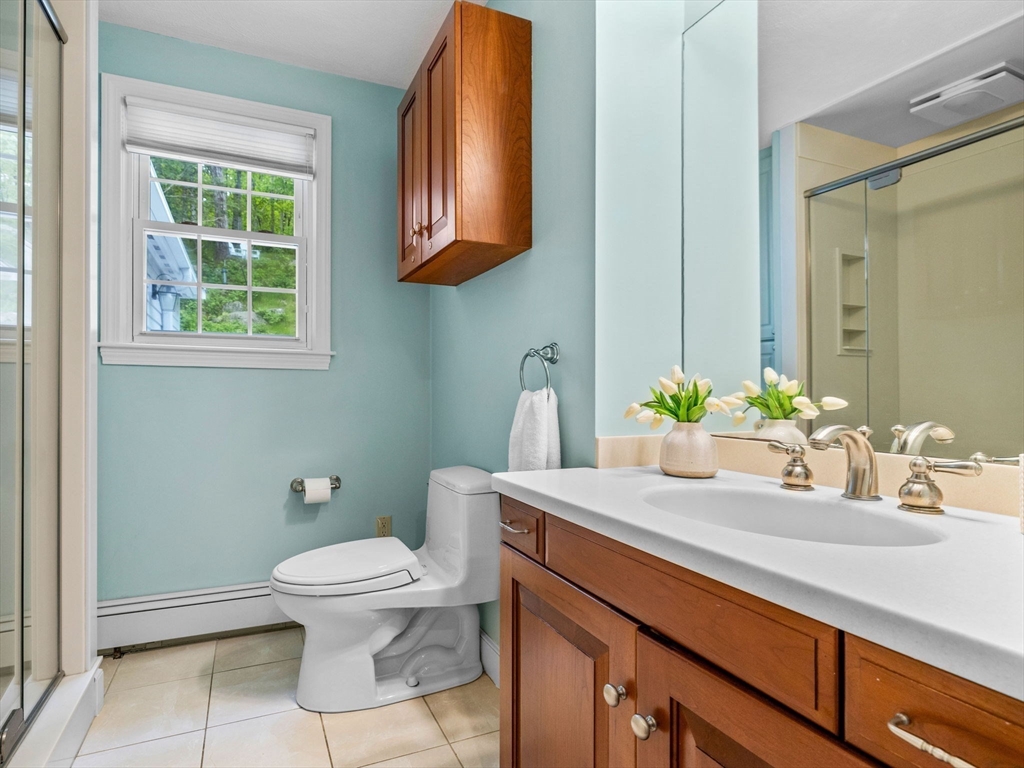 14 Pond Street Dover, MA 02030 - Photo 20 of 25 a bathroom with a sink a toilet and a mirror