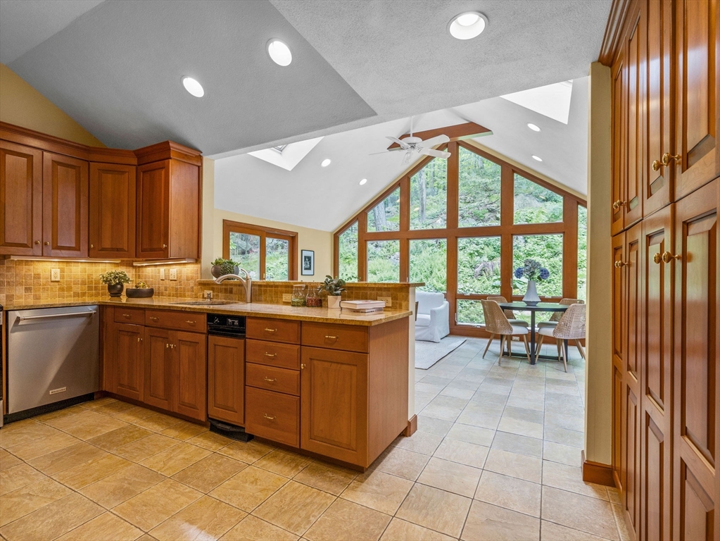 14 Pond Street Dover, MA 02030 - Photo 6 of 25 a kitchen with a sink and wooden cabinets