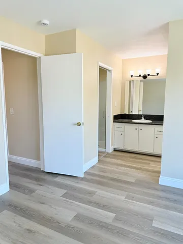 a view of a kitchen with wooden floor