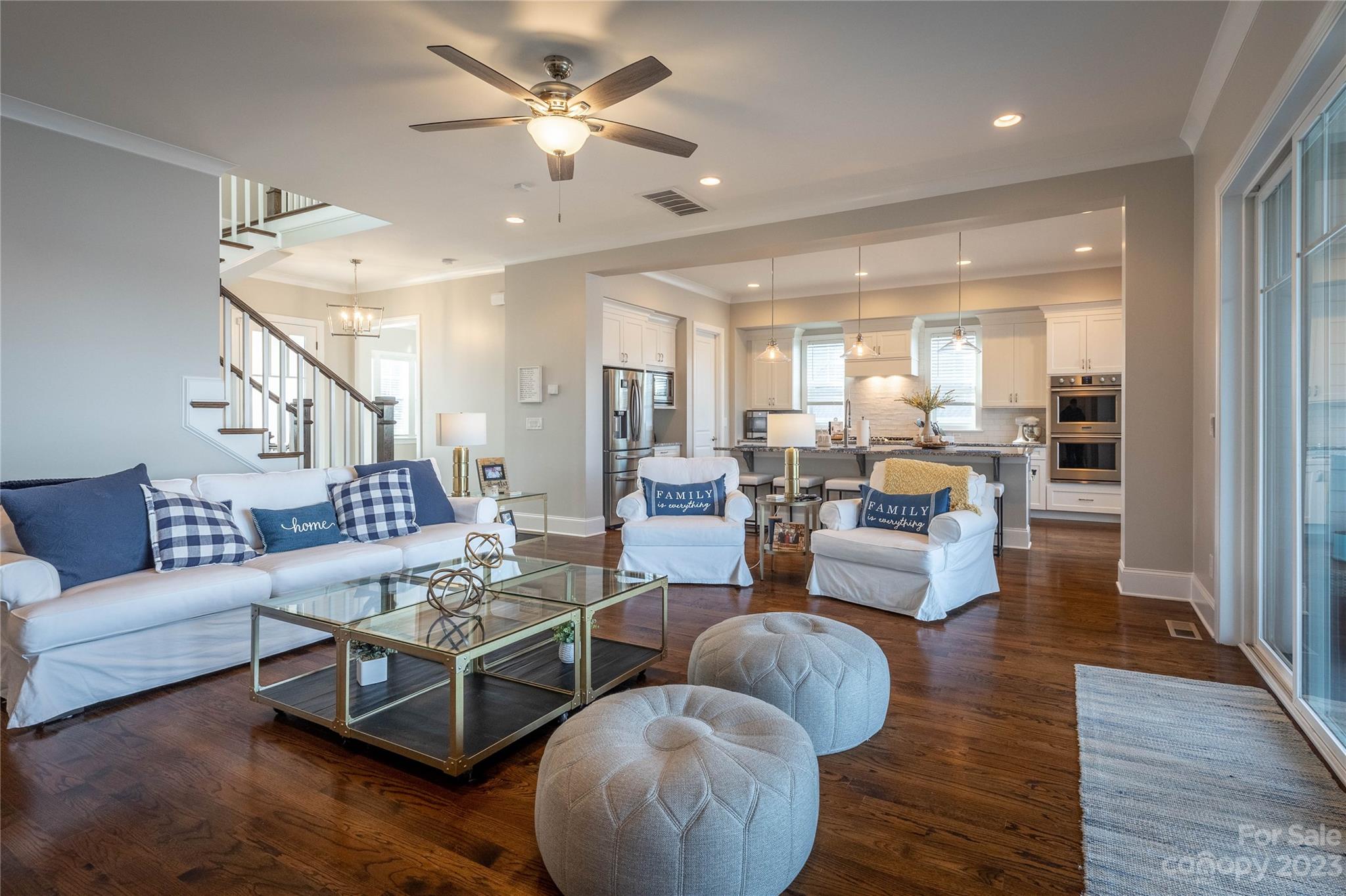 9110 Greenwood Road Terrell, NC 28682 - Photo 12 of 42 a living room with furniture wooden floor and a chandelier