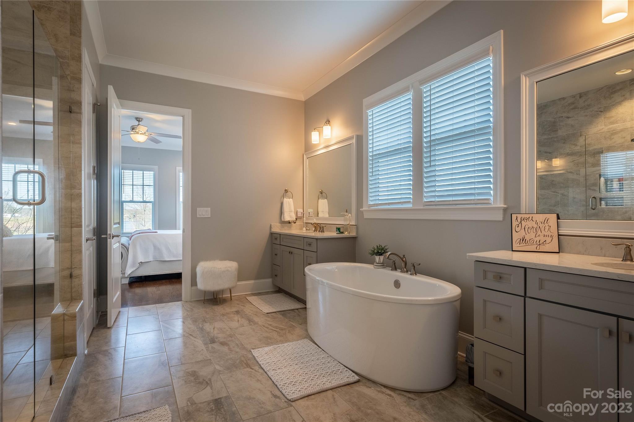 9110 Greenwood Road Terrell, NC 28682 - Photo 22 of 42 a bathroom with a white tub a sink and mirror