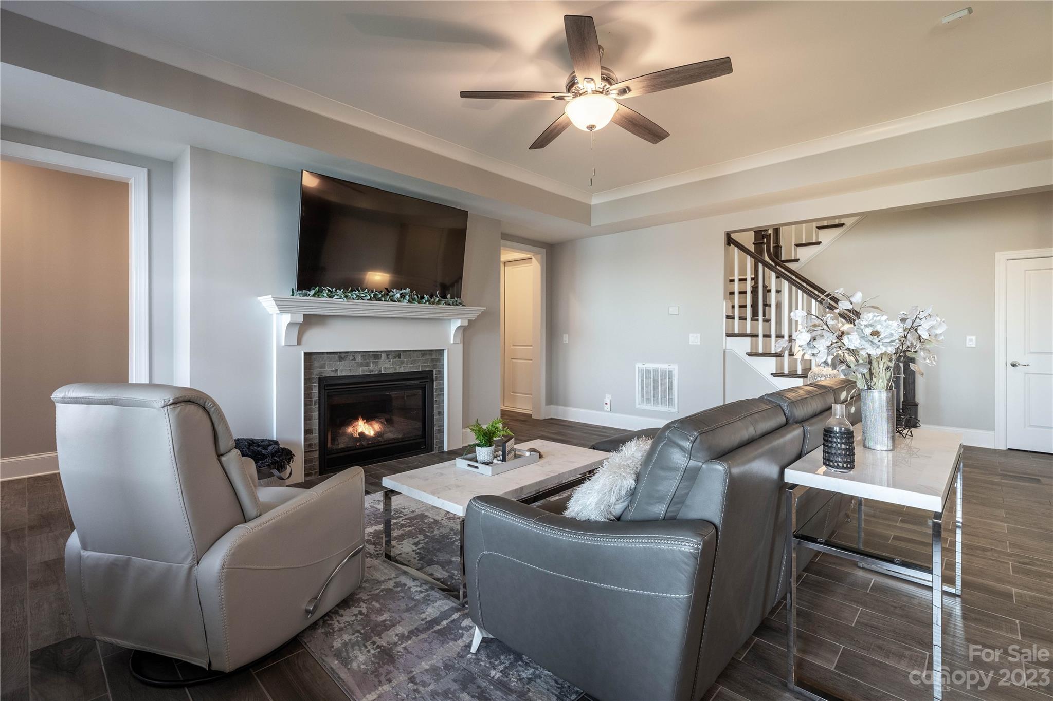 9110 Greenwood Road Terrell, NC 28682 - Photo 29 of 42 a living room with furniture a flat screen tv and a fireplace