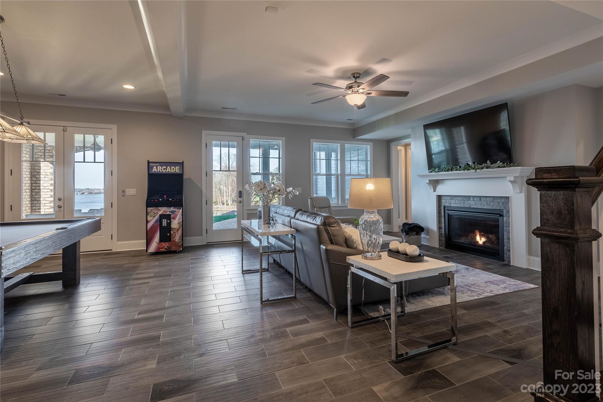 9110 Greenwood Road Terrell, NC 28682 - Photo 31 of 42 a living room with furniture a fireplace and a flat screen tv