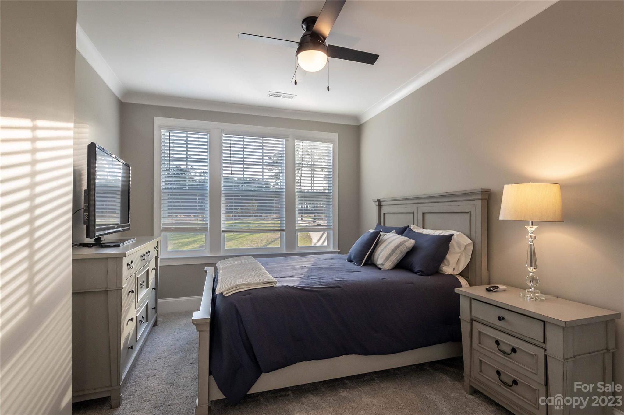 9110 Greenwood Road Terrell, NC 28682 - Photo 34 of 42 a bedroom with a bed and a flat tv screen on dresser