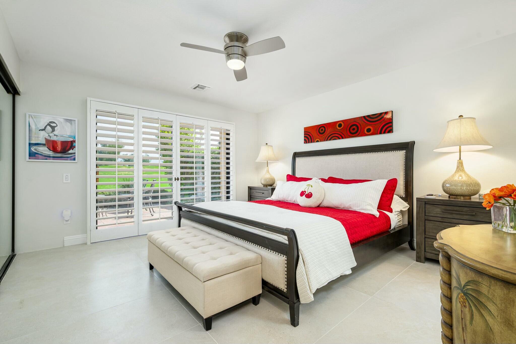 38 Mission Court Rancho Mirage, CA 92270 - Photo 51 of 61 a bedroom with a bed and a couch