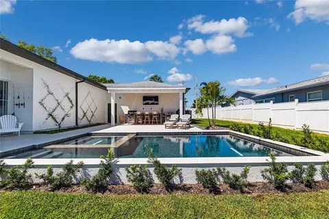 a view of a swimming pool with a patio