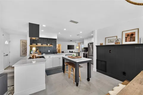 a kitchen with cabinets and window