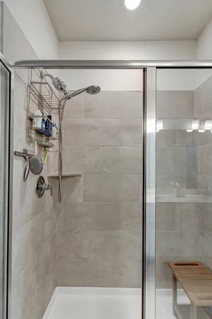 a bathroom with a glass shower door