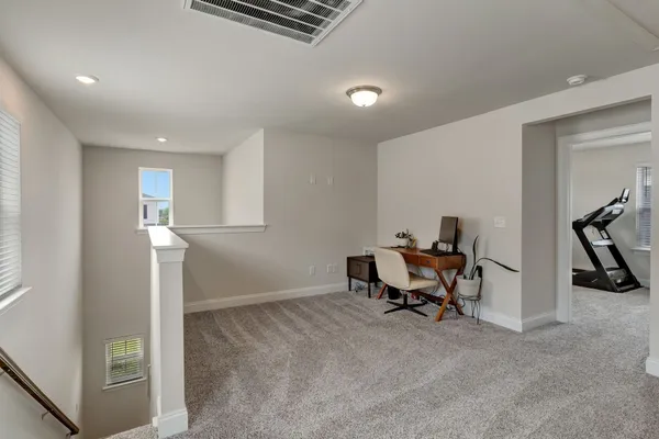 a view of a workspace with furniture