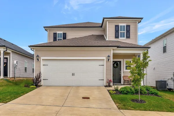 front view of a house with a yard
