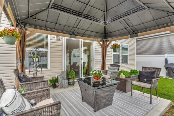 a view of a patio filled with furniture