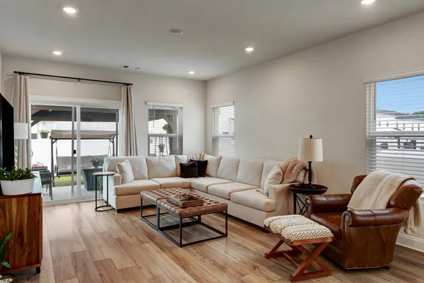 a living room with furniture and a table