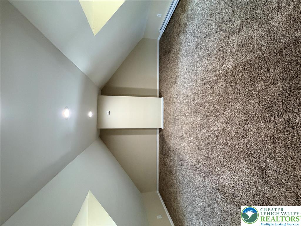 718 Ferry Street Easton, PA 18042 - Photo 22 of 37 Sloping ceilings and plush carpeting define this versatile interior space.