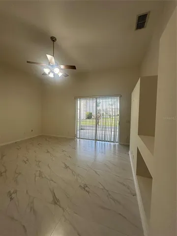 a view of an empty room with a window