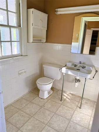 a bathroom with a tub and sink
