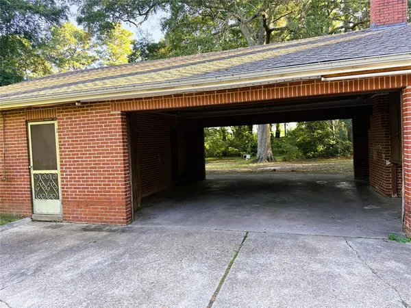 an empty room with wooden floor and a window
