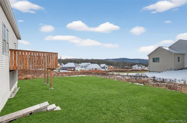 a view of a house with backyard