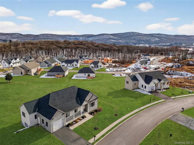 a view of a garden with sitting area