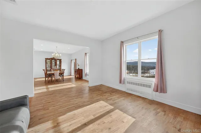 a view of a livingroom with wooden floor and a couch