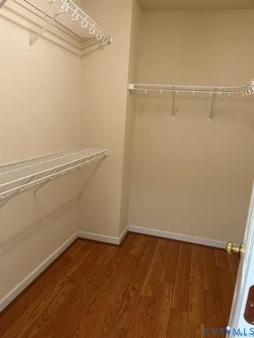 a view of a room with wooden floor