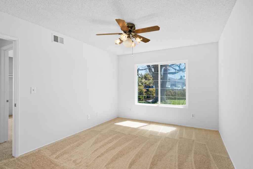 664 Mariposa Circle Chula Vista, CA 91911 - Photo 15 of 34 an empty room with a window and a ceiling fan