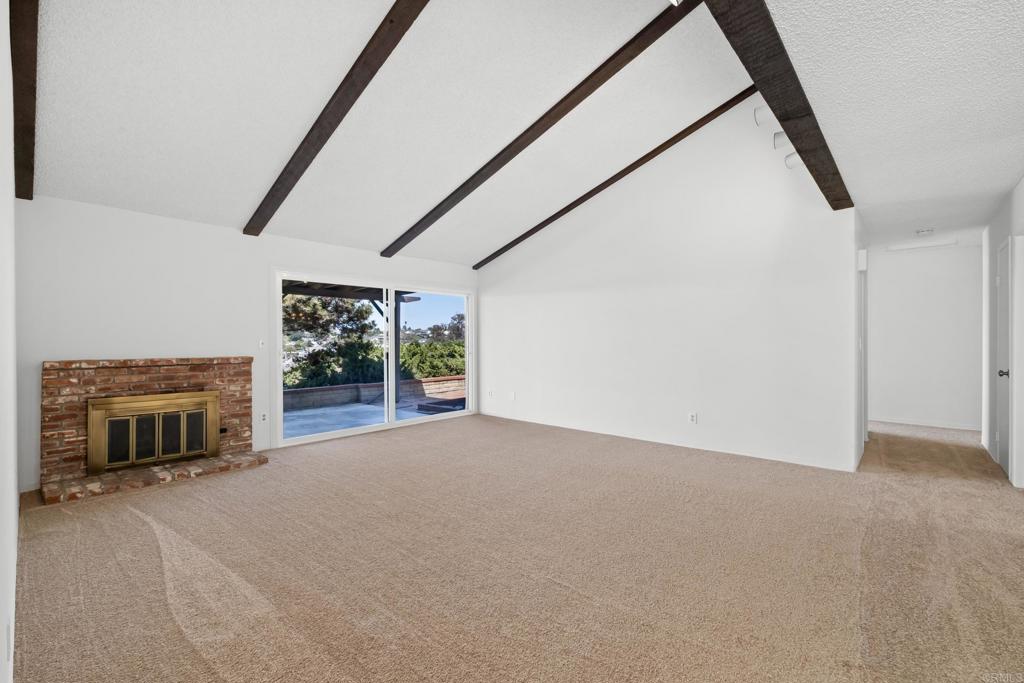 664 Mariposa Circle Chula Vista, CA 91911 - Photo 5 of 34 a view of empty room with fireplace and window