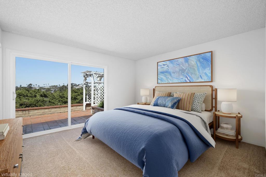 664 Mariposa Circle Chula Vista, CA 91911 - Photo 10 of 34 a bed sitting in a bedroom next to a window