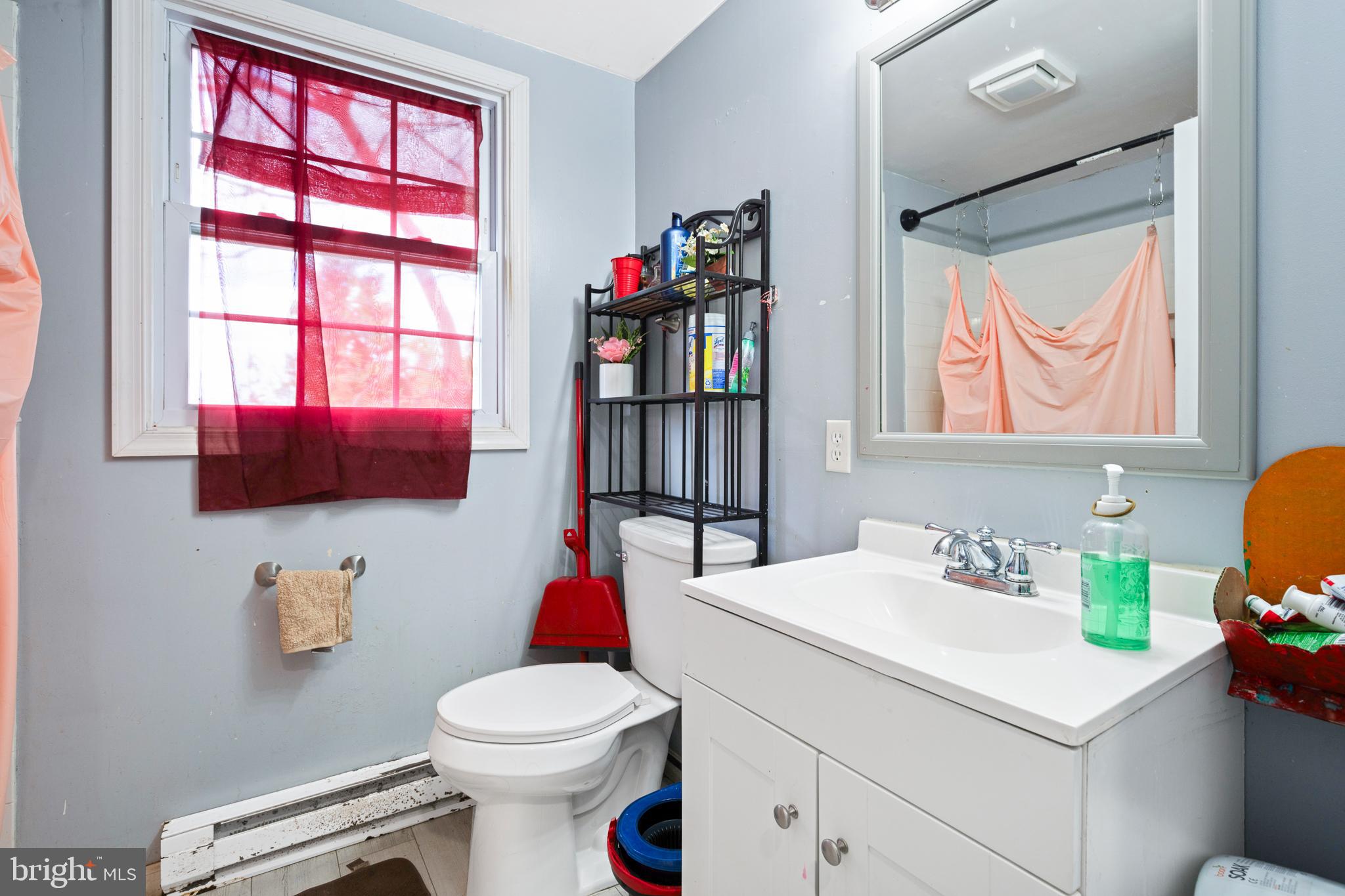 1731 Limestone Road Cochranville, PA 19330 - Photo 12 of 29 a bathroom with a sink vanity mirror and toilet