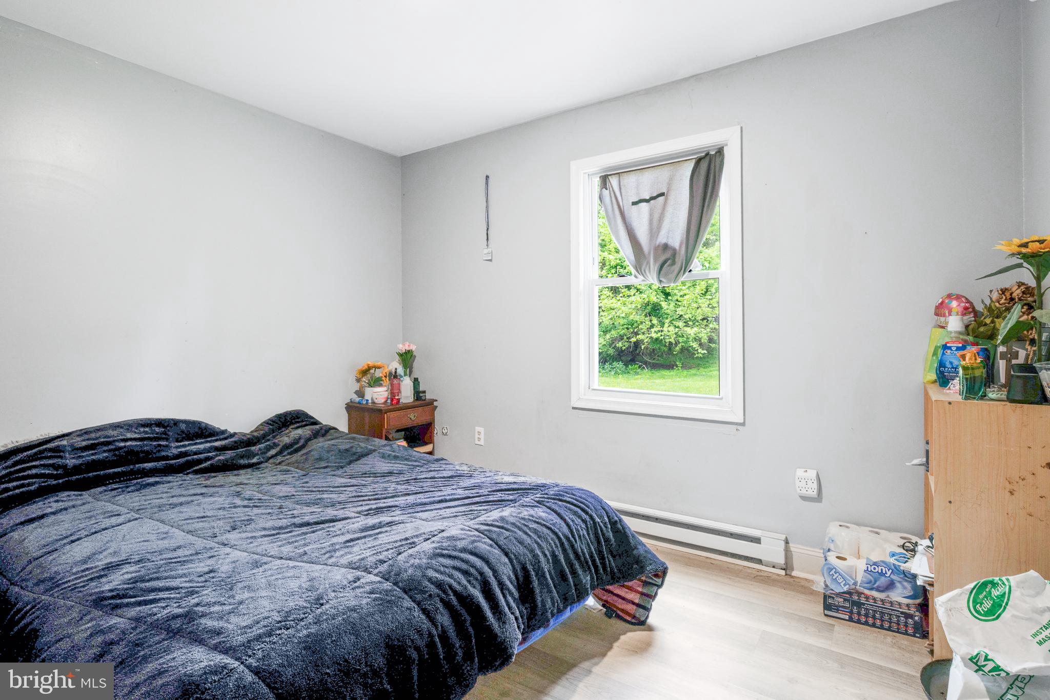1731 Limestone Road Cochranville, PA 19330 - Photo 16 of 29 a bedroom with a bed and a window