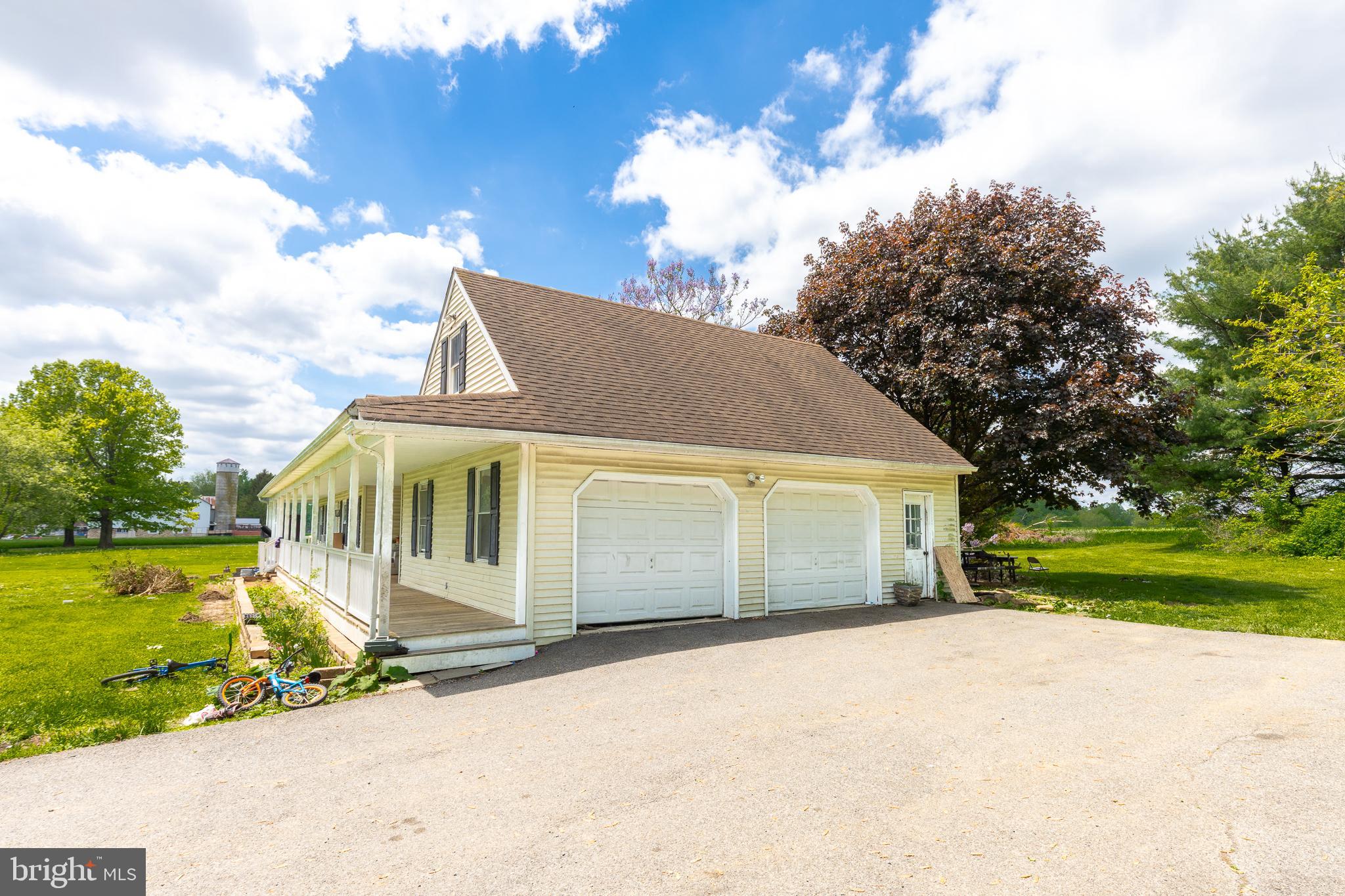 1731 Limestone Road Cochranville, PA 19330 - Photo 25 of 29 a front view of a house with a yard and garage