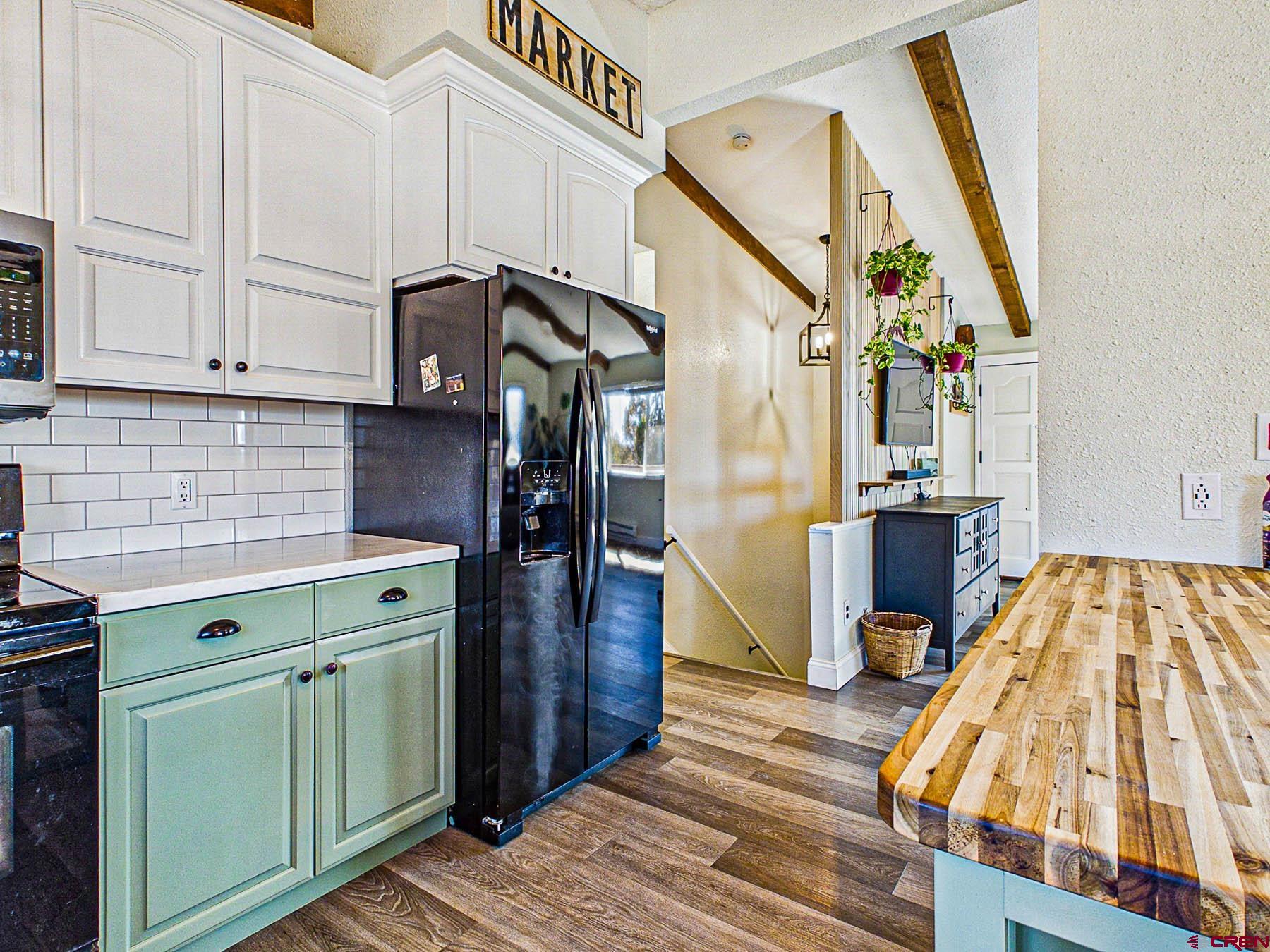 18697 Ward Creek Road Cedaredge, CO 81413 - Photo 18 of 45 a view of a kitchen with storage and utility