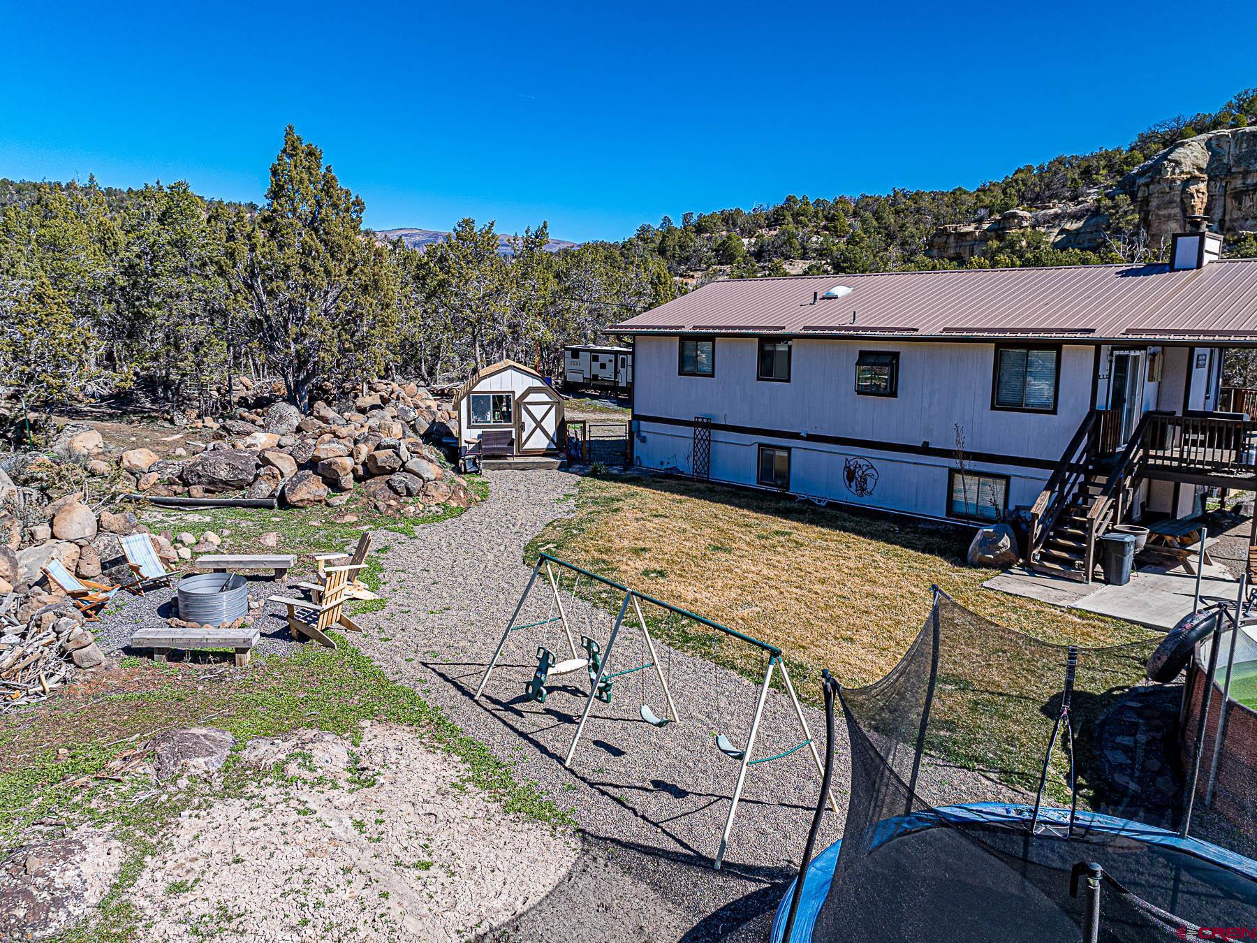 18697 Ward Creek Road Cedaredge, CO 81413 - Photo 37 of 45 a view of a house with roof deck