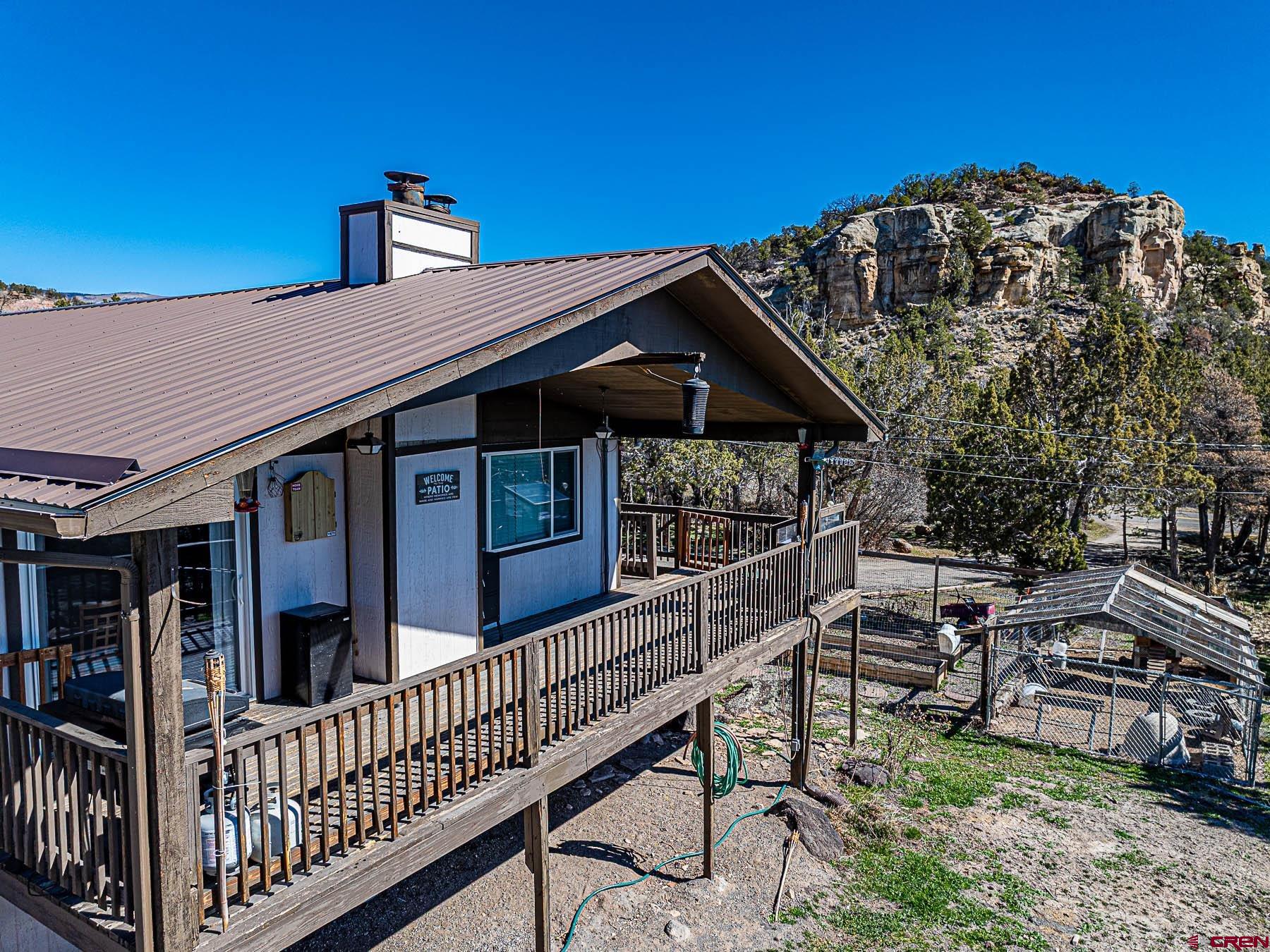 18697 Ward Creek Road Cedaredge, CO 81413 - Photo 40 of 45 a view of a house with roof deck