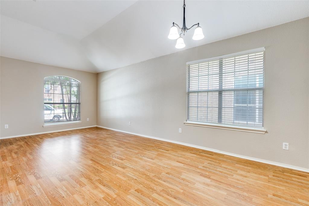 1117 Red Hawk Drive Frisco, TX 75033 - Photo 12 of 31 a view of an empty room with wooden floor and a window