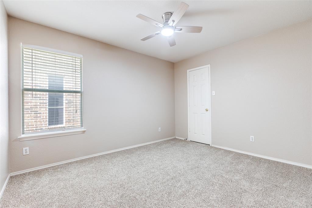 1117 Red Hawk Drive Frisco, TX 75033 - Photo 14 of 31 an empty room with a window and a ceiling fan